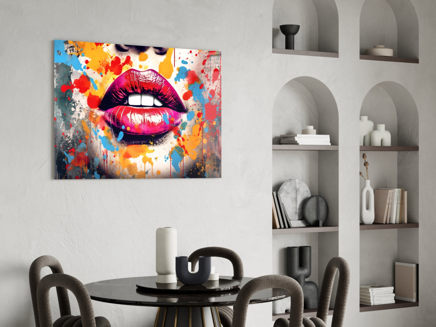 Vibrant pop art glass wall panel featuring bold magenta lips with colorful paint splatters, displayed above round dining table in modern interior.