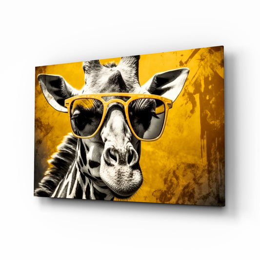 A black and white giraffe wearing yellow-framed sunglasses centered on a mustard yellow textured glass panel, displayed at an angled three-quarter view.