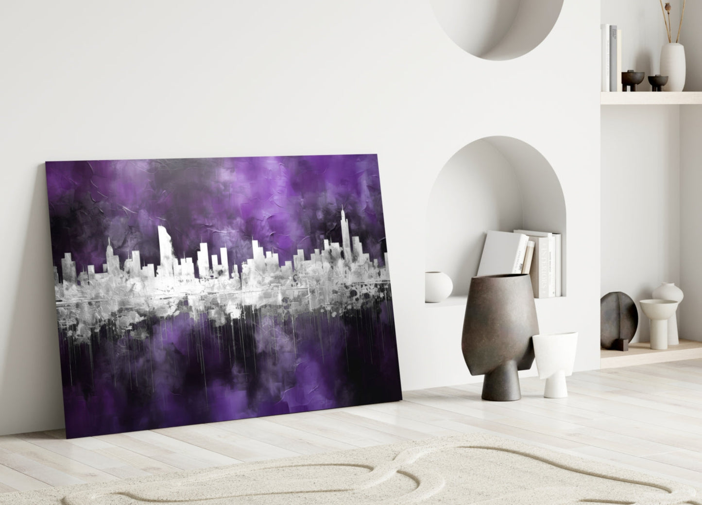 Purple and white cityscape glass art leaning against white wall in minimalist room setting.