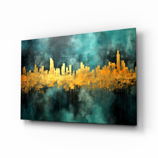 Angled view of glass wall art featuring a gold cityscape silhouette against teal and dark stormy background with dripping effect.