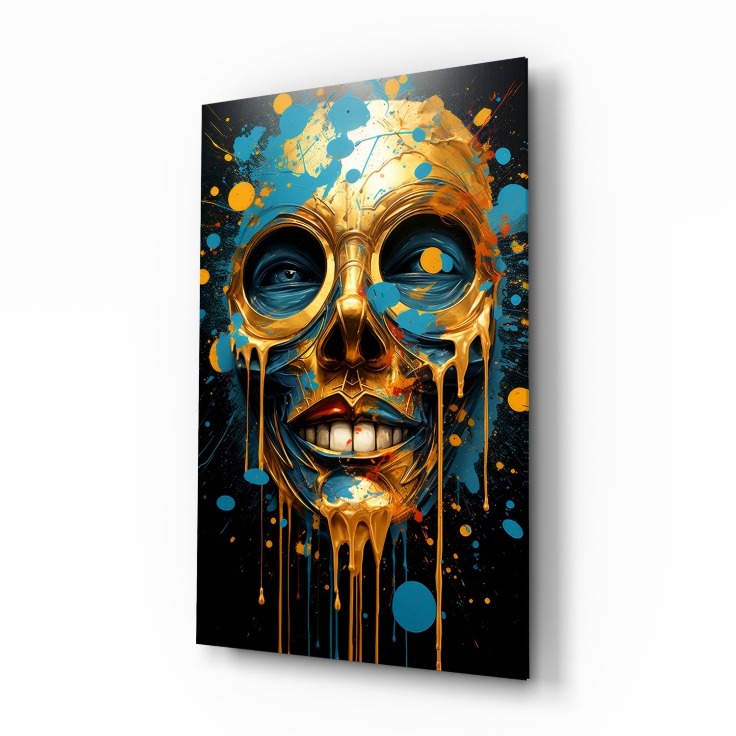 Gold and blue glass skull wall art with dripping effect displayed at an angle against white background.