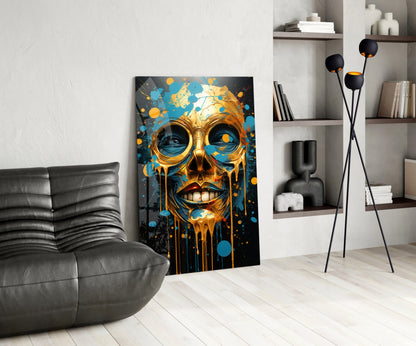 Modern living room featuring gold and blue abstract skull artwork leaning against wall beside gray leather chair.