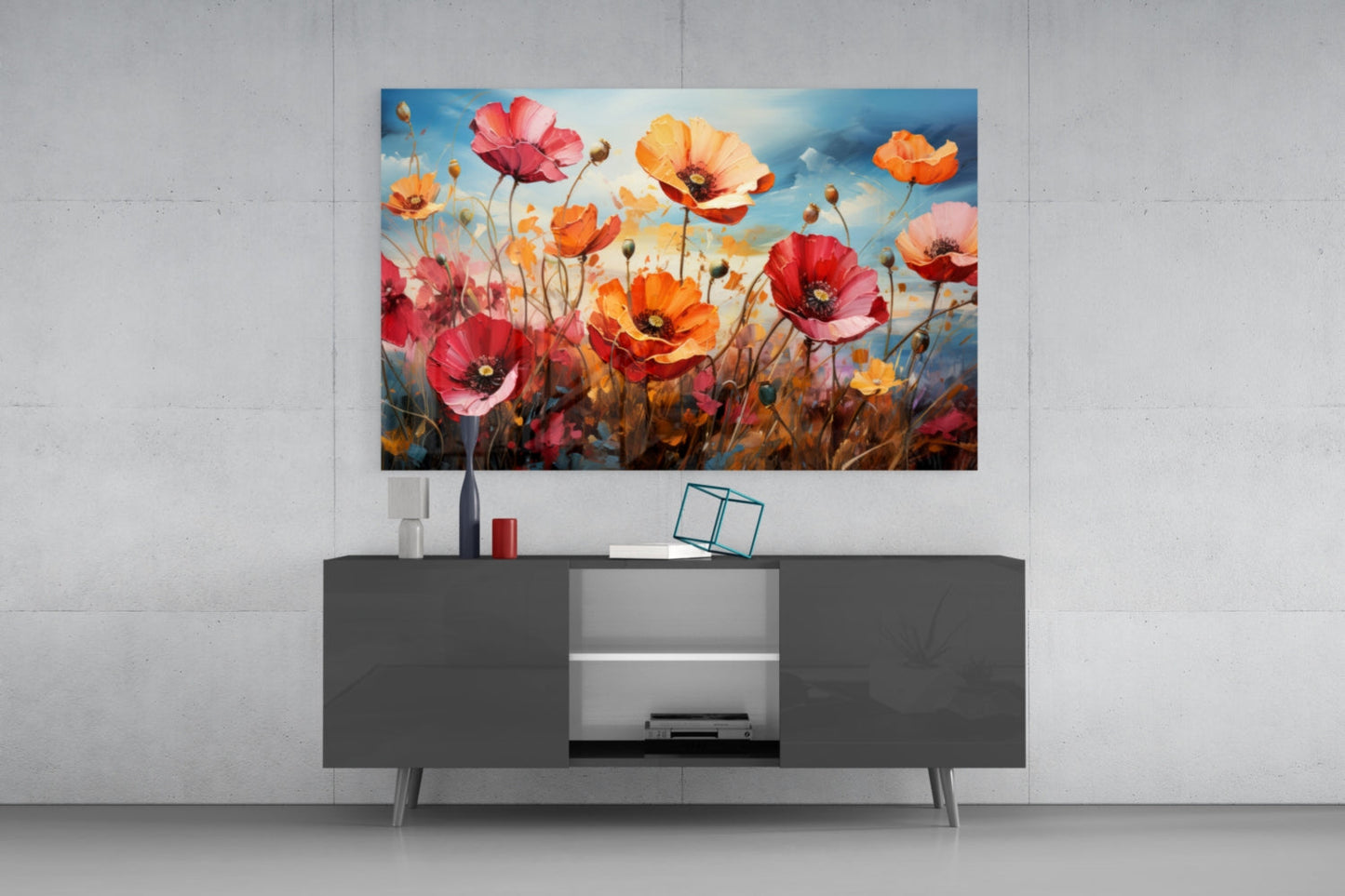 Vibrant poppy flower glass art hanging above a dark media console with decorative accessories.