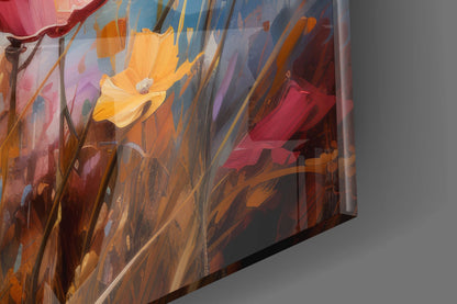 Close-up angled view of glass wall art displaying yellow poppy with red and pink flowers against blue background, sunlight creating shadows on gray wall.