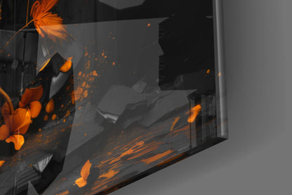 Close-up angled view of glass wall art featuring orange and black butterflies with splatter effects on dark background.