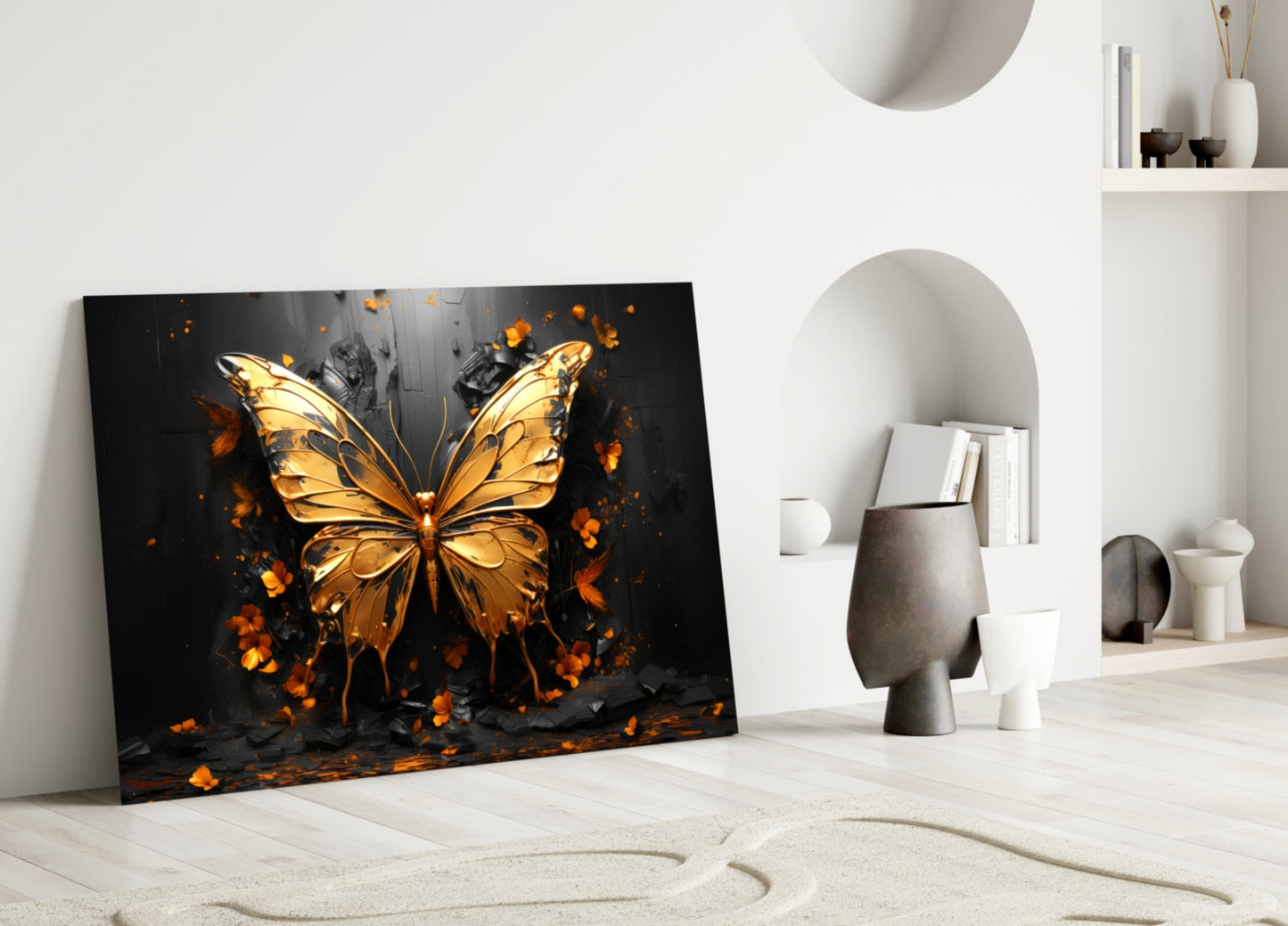 Golden butterfly glass wall art leaning against white wall in minimalist interior with decorative objects and shelving.