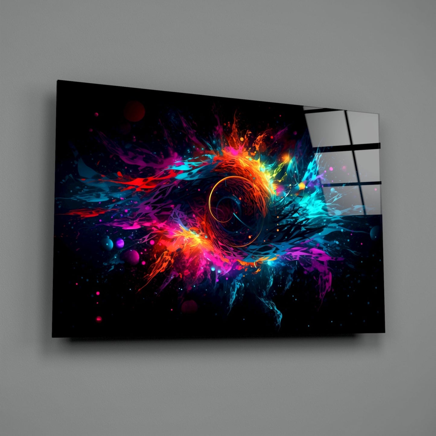 Angled three-quarter view of glass wall art featuring vibrant neon colors radiating from central circle on black background.
