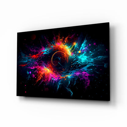 Angled perspective of black glass wall art panel displaying vibrant multicolored explosion with central circular hole, surrounded by neon red, blue, cyan, and magenta bursts.