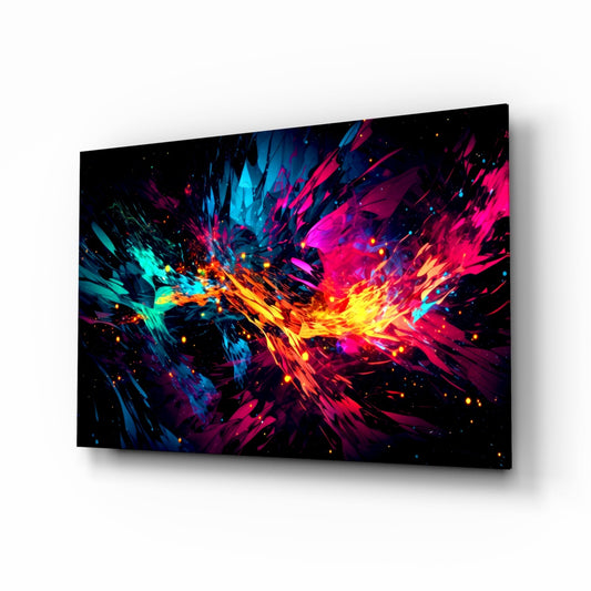Angled perspective view of glass wall art displaying vibrant cyan, magenta, yellow, and orange abstract burst pattern on black background.