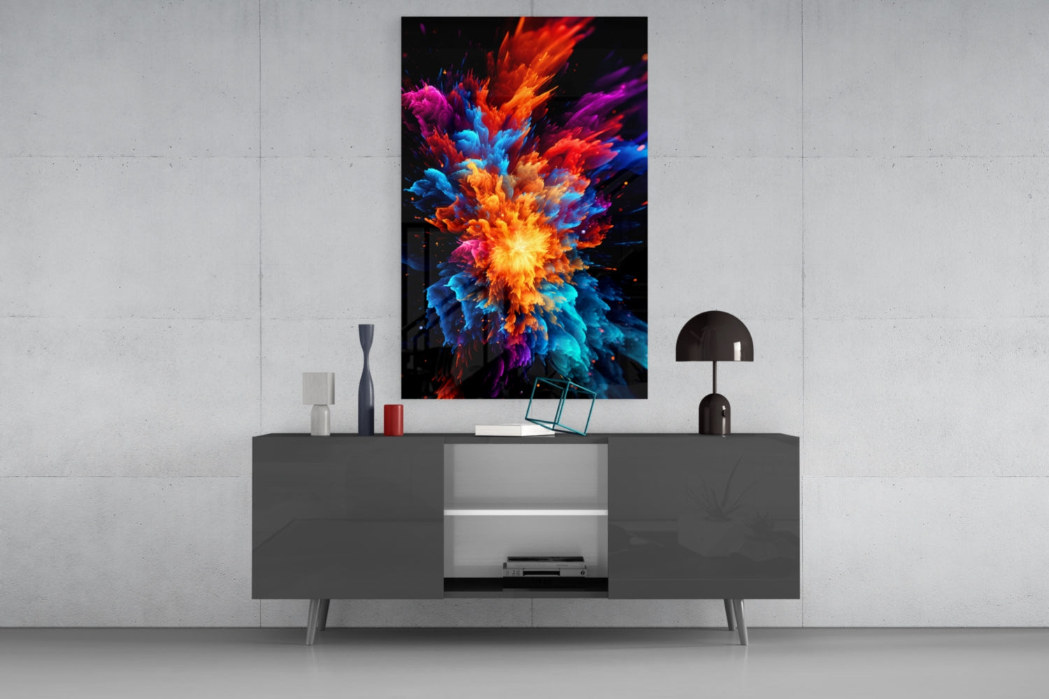 Colorful abstract explosion artwork displayed on white wall above modern gray media console with decorative items.