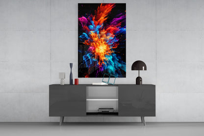 Colorful abstract explosion artwork displayed on white wall above modern gray media console with decorative items.
