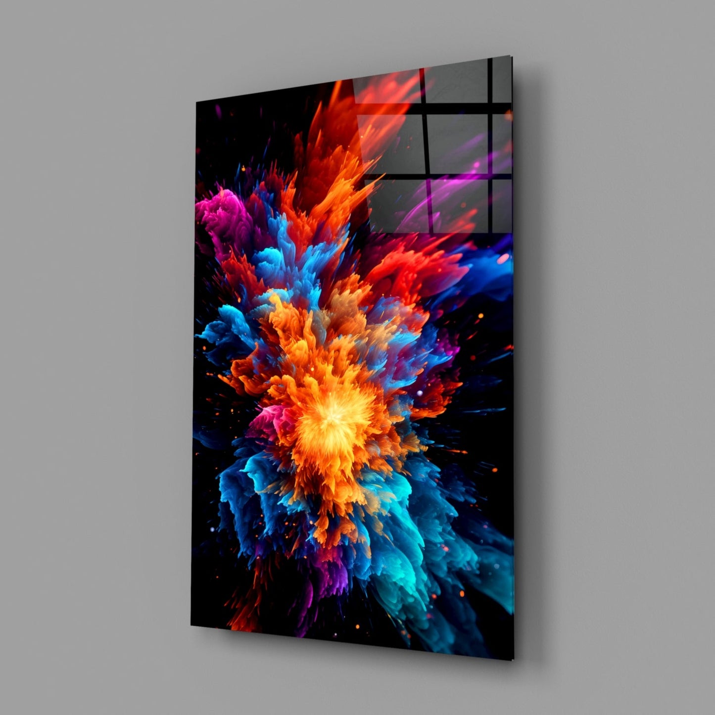 Angled perspective of a glass wall panel displaying a vibrant multicolored explosion of red, orange, yellow, blue, cyan, magenta, and purple particles radiating from a bright center against black background.
