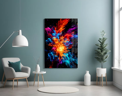 Vibrant multicolored glass wall art featuring an explosive burst of red, orange, blue, and purple displayed in a modern room setting.