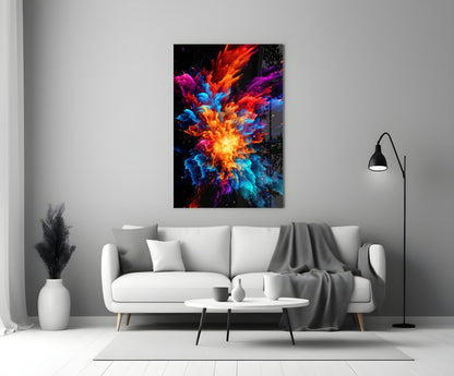 Colorful glass wall art with vibrant red, orange, blue, and purple explosion design mounted above white sofa in modern living room.