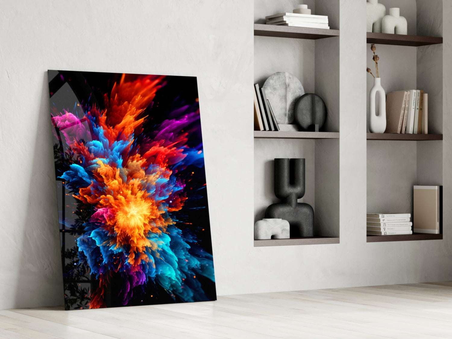 Colorful abstract flower explosion glass art leaning against white wall beside floating shelves with decorative objects.