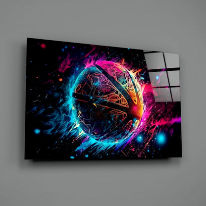 Angled view of glass wall art displaying a neon-glowing sphere with cyan, magenta, and yellow energy effects on black background.