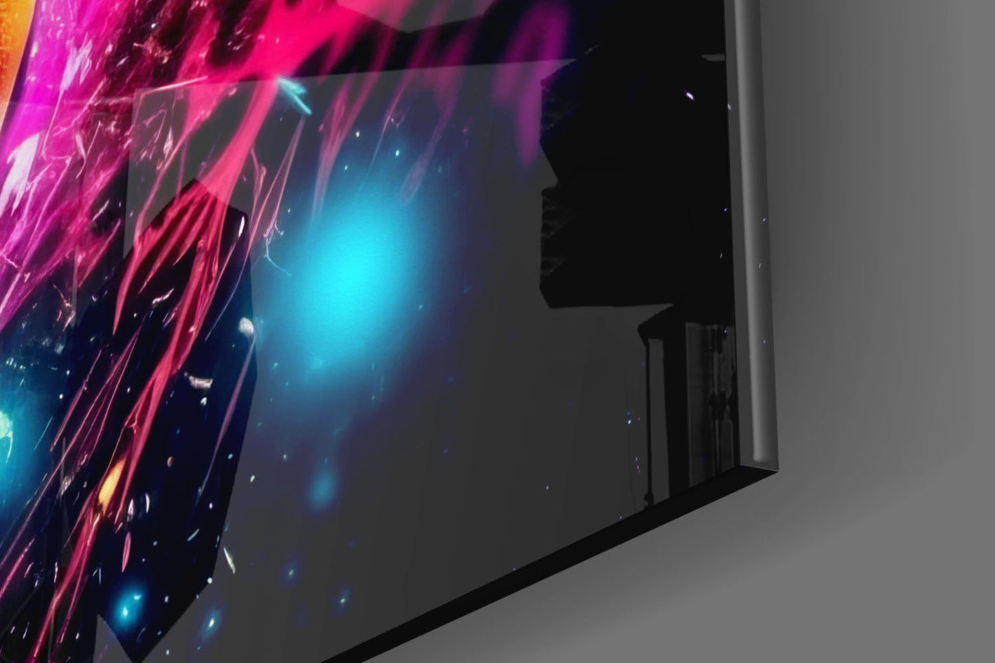 Angled view of illuminated glass wall art displaying vibrant magenta, cyan, and gold streaking light effects against dark background.