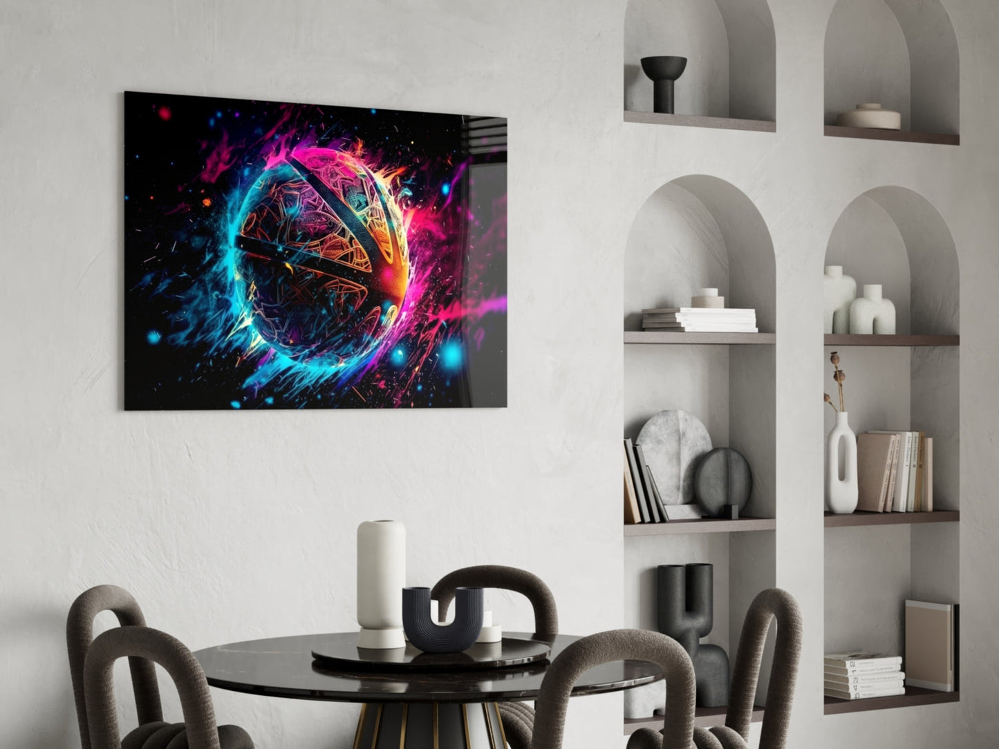 Neon fireball glass wall art with vibrant magenta, cyan, and yellow energy effects displayed above a black dining table in a modern interior.