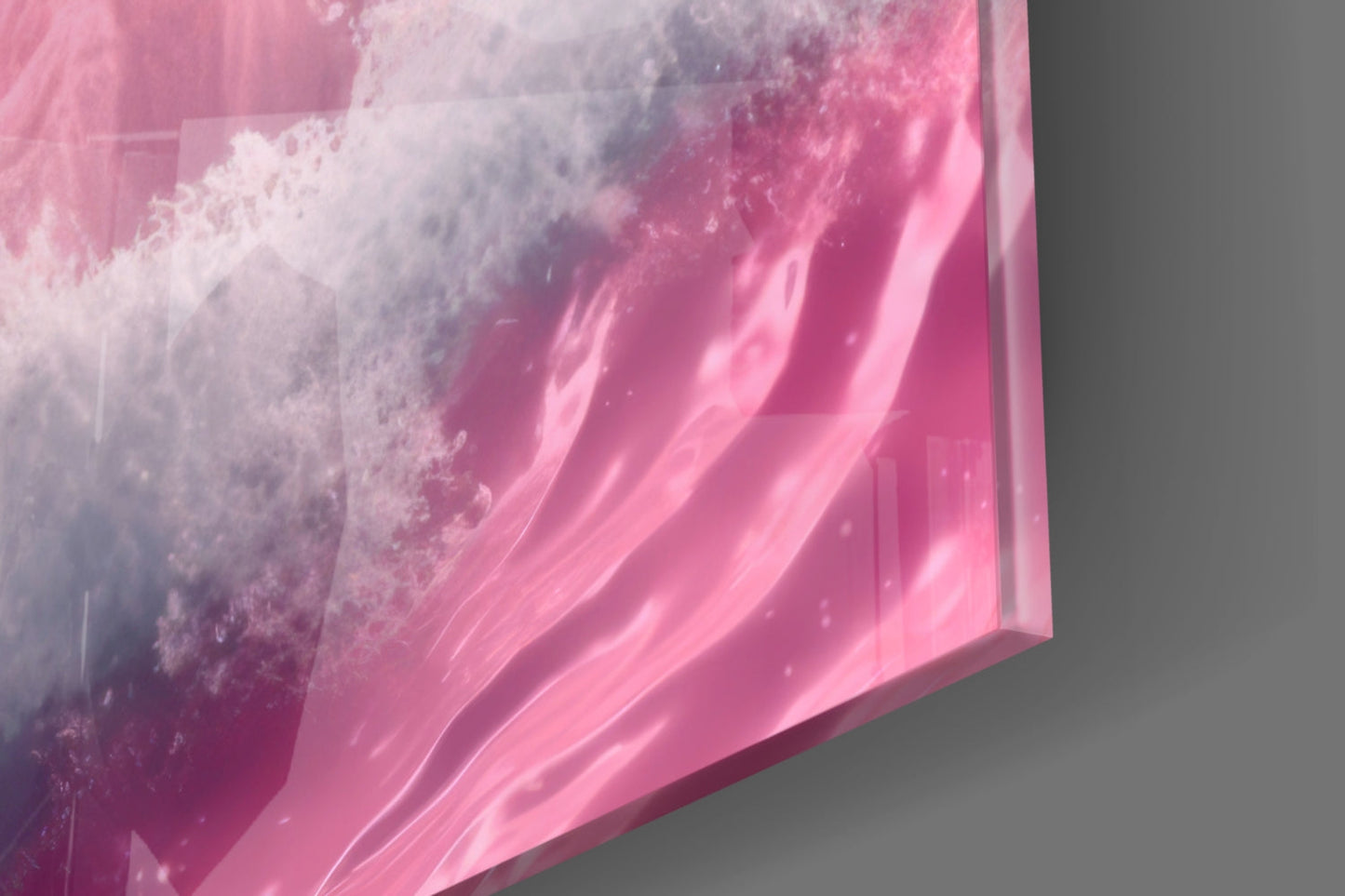 Close-up angled view of pink glass wall art with white crystalline texture and flowing striped patterns against gray background.