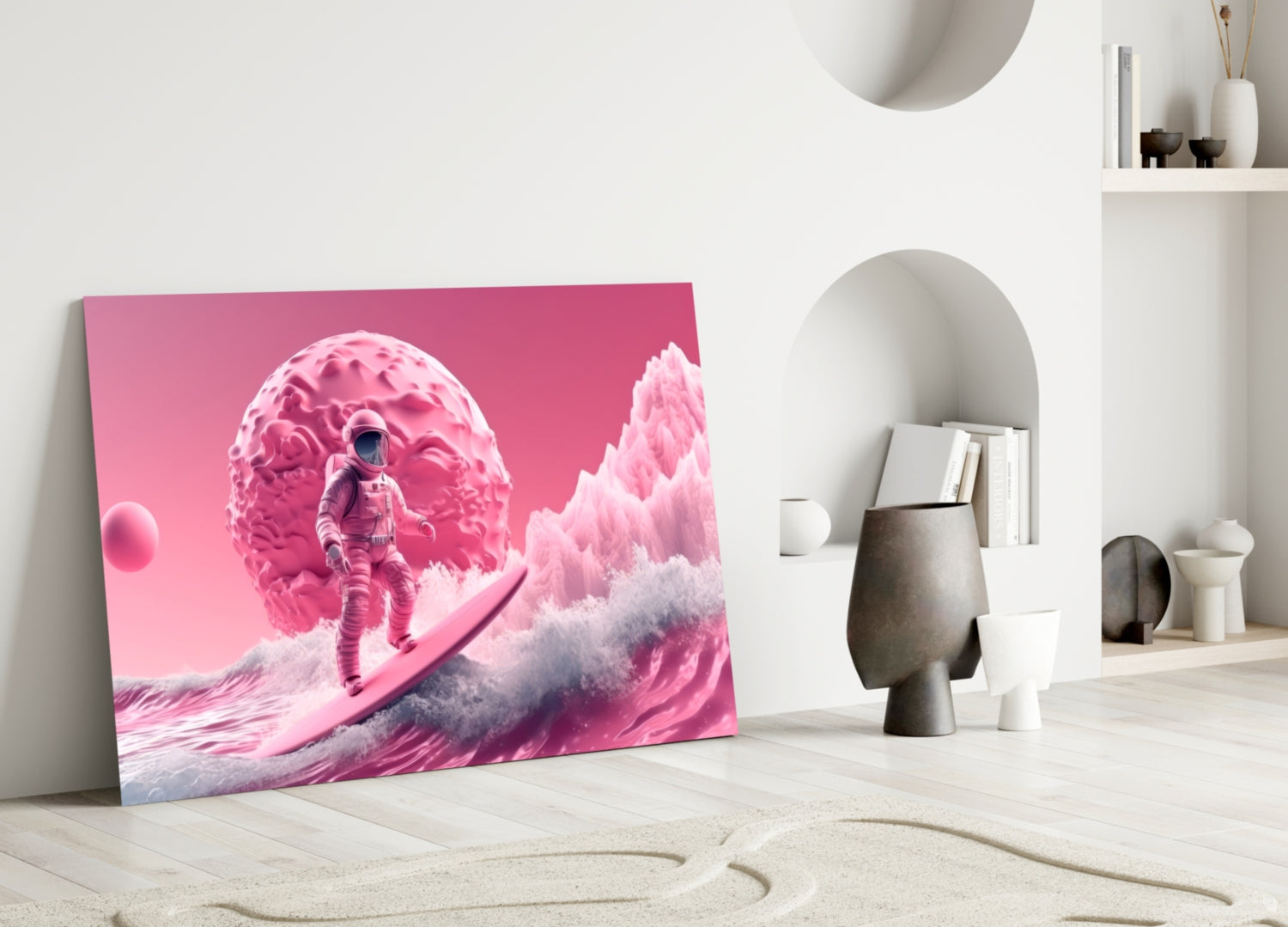 Vibrant pink glass art panel leaning against white wall displays surreal astronaut surfing scene with alien landscape.