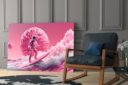 Surreal pink glass wall art depicting an astronaut surfing near a giant brain-shaped planet, displayed in modern living room setting.