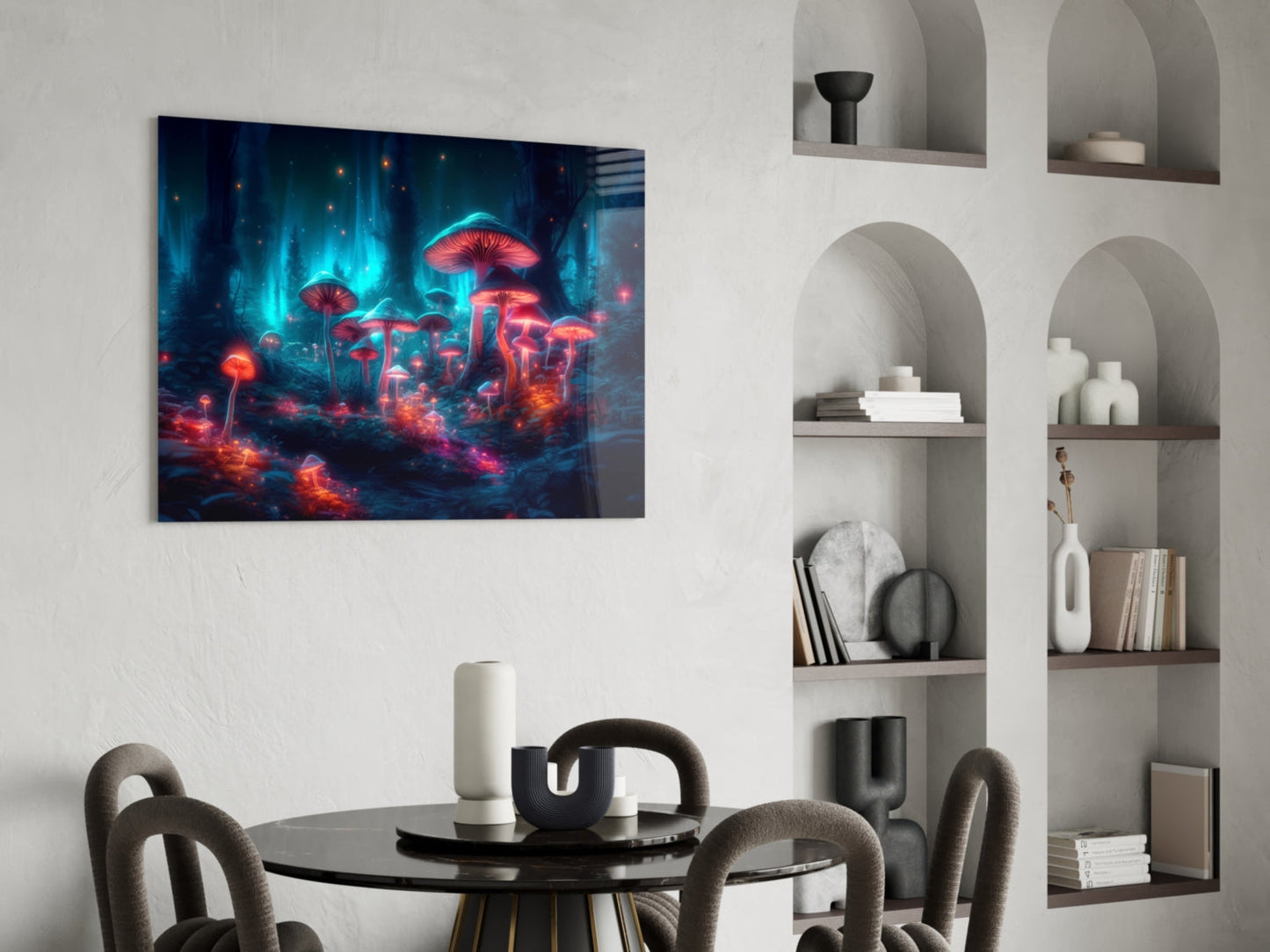 Neon mushroom forest glass wall art displayed above a round black dining table with gray chairs in a modern interior with white built-in shelving.
