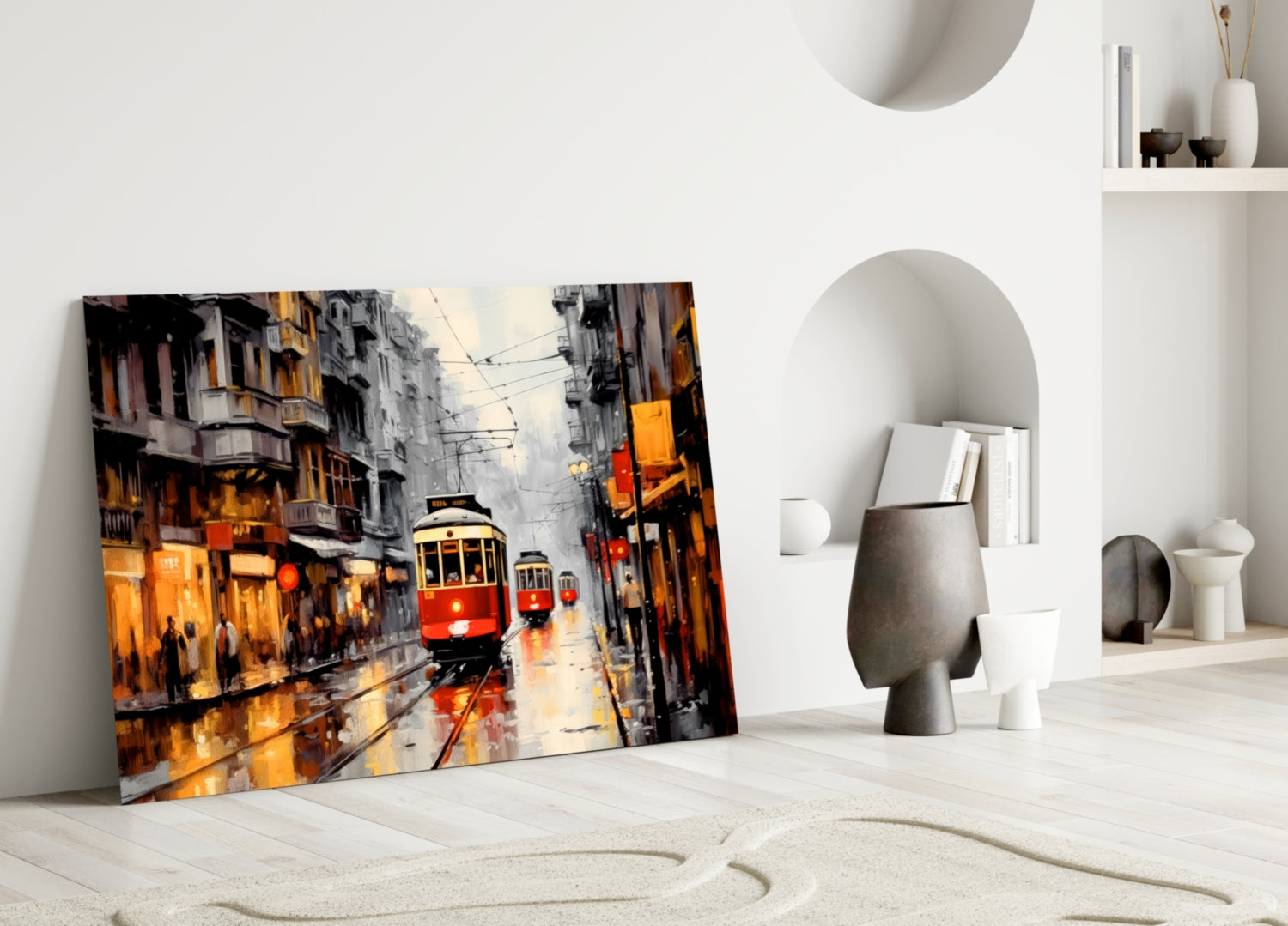 Red tram street scene glass art leaning against white wall in minimalist interior setting.