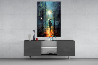 Modern living room with dark console table displaying rainy street scene glass wall art above, featuring silhouetted figure with umbrella.