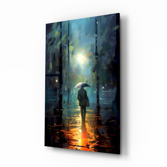 Glass wall art panel displaying an illustration of a solitary figure with umbrella standing in a rain-lit urban alley, viewed at an angle showing depth and shadow.