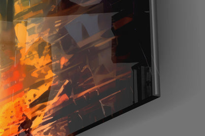 Close-up angled view of glass wall art displaying vibrant orange and red flame artwork against gray wall background.
