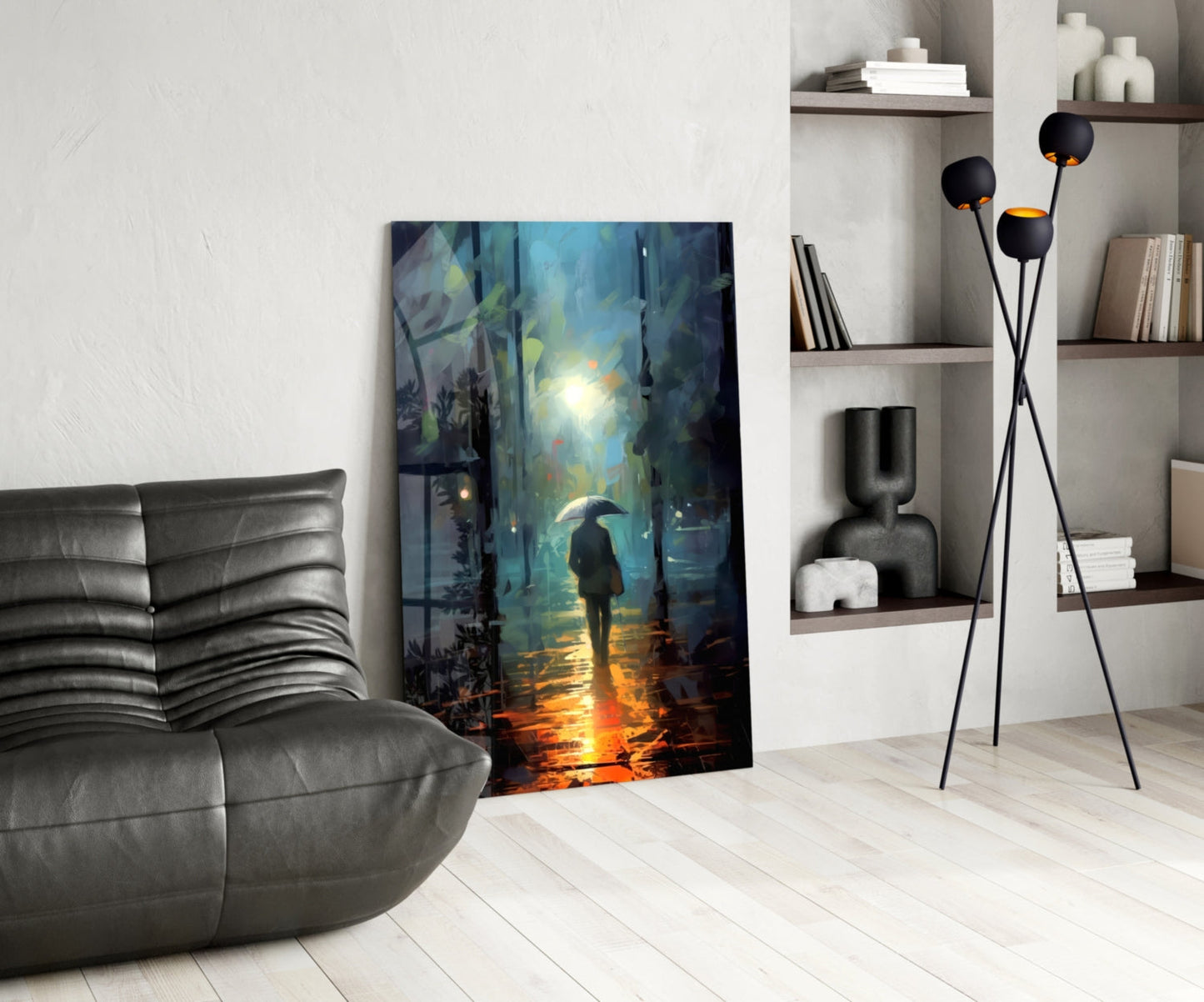 Glass wall art depicting a solitary figure with umbrella standing in a rainy urban street with blue and golden light reflections, displayed in modern living room setting.