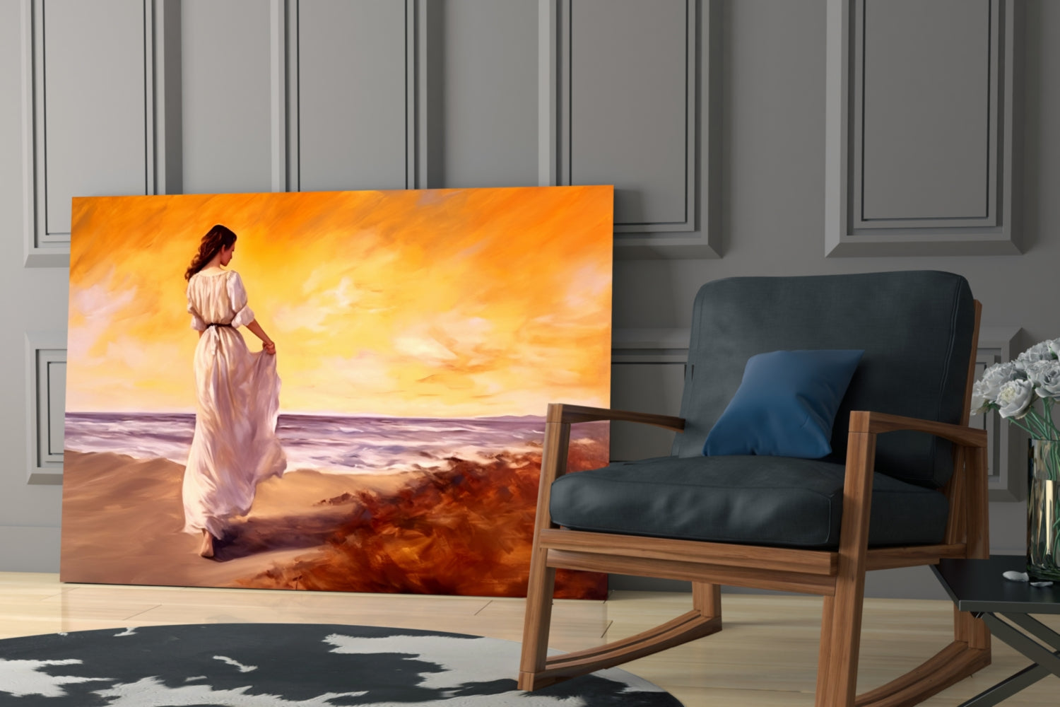 Glass wall art depicting a woman in a white dress standing on a beach at sunset, displayed in a modern interior with a wooden chair.