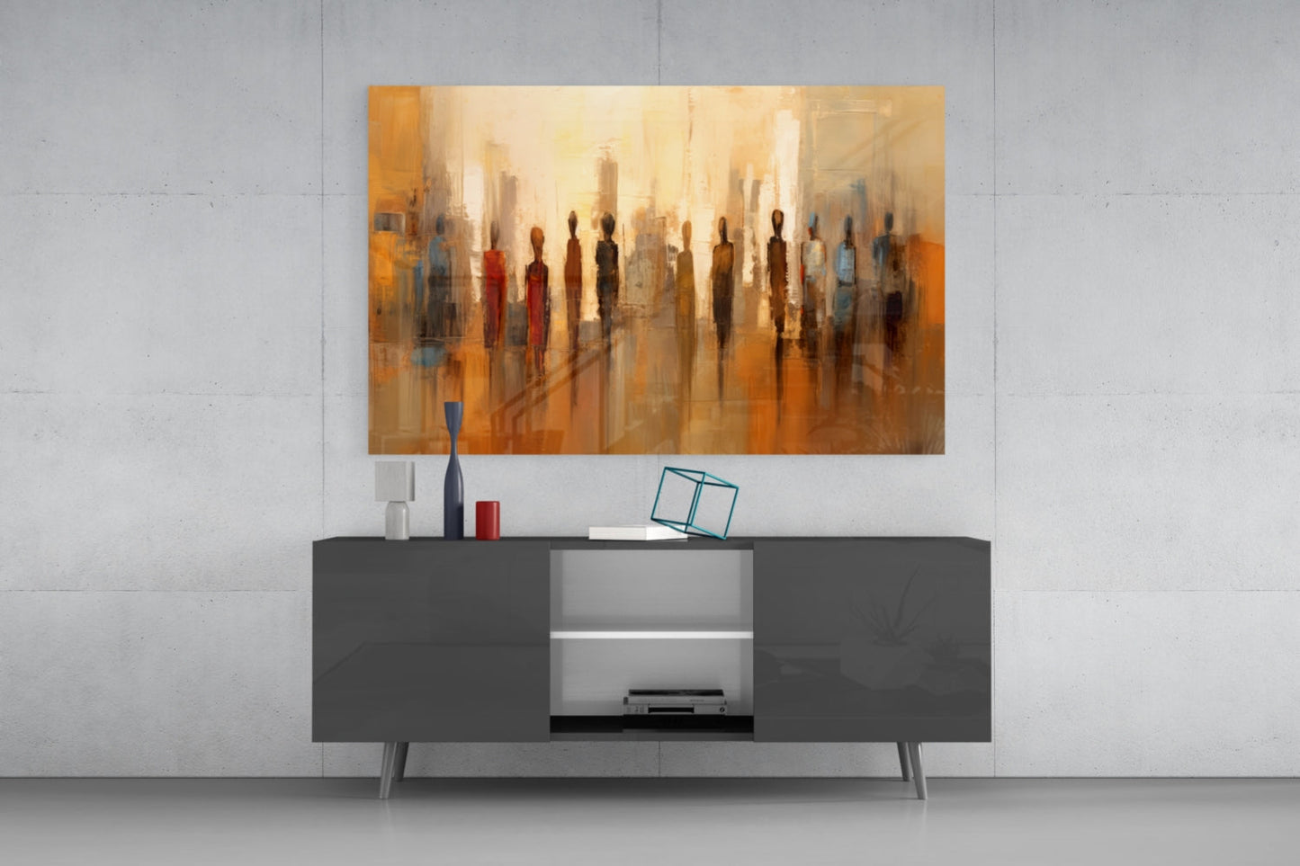 Abstract glass wall art depicting silhouetted figures in warm golden and orange tones displayed above a dark modern console table.