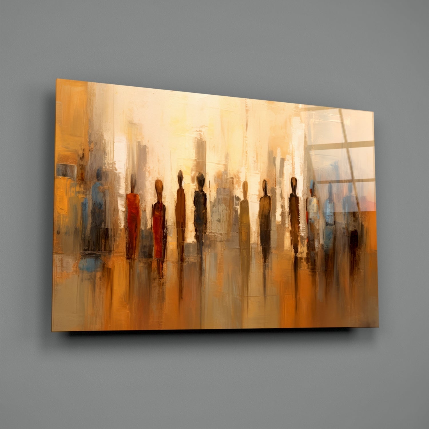 Abstract glass wall art featuring silhouetted figures in warm orange, gold, and brown tones against a cityscape background, mounted on gray wall.