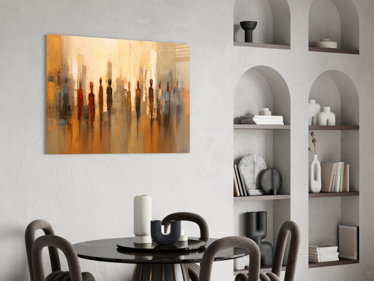 Abstract golden-toned glass art depicting silhouetted figures displayed above a black dining table in modern interior setting.
