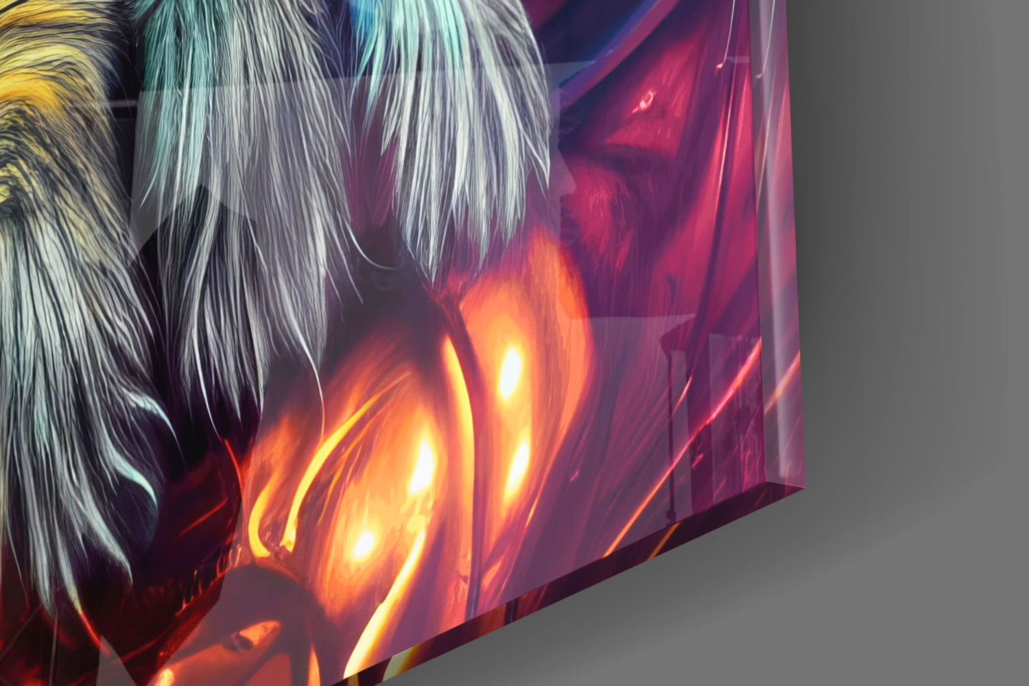 Close-up angled view of glass wall art displaying white and silver hair with vibrant orange and red flame effects against gray background.