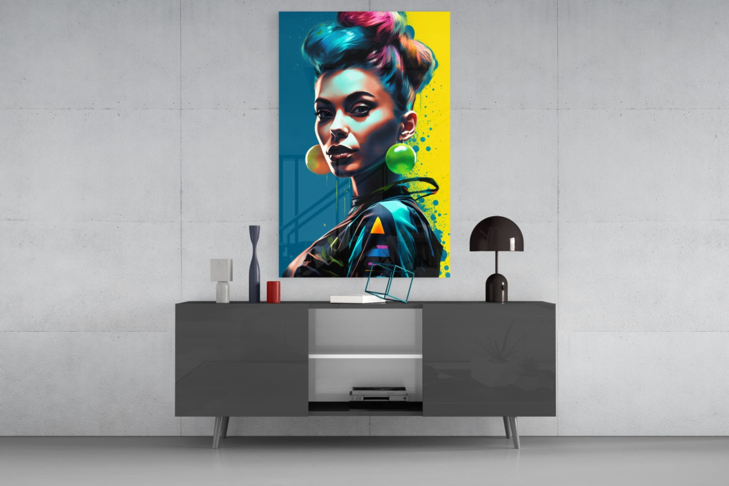 Colorful pop art portrait with teal and yellow background displayed above modern gray console table with black lamp and decorative accessories.
