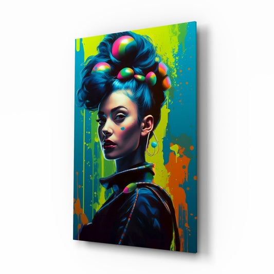 Angled view of a glass wall art panel featuring a stylized portrait of a woman with an upswept hairstyle adorned with colorful spheres, set against a vibrant yellow and teal splattered background.