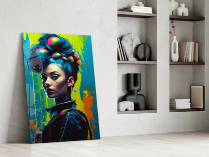 Vibrant pop art glass canvas leaning against white wall displays colorful woman's portrait with neon hair and paint splashes.