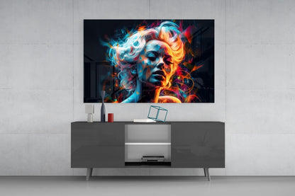 Vibrant neon portrait of a face with blue and orange glowing effects displayed on wall-mounted glass art above gray media console.