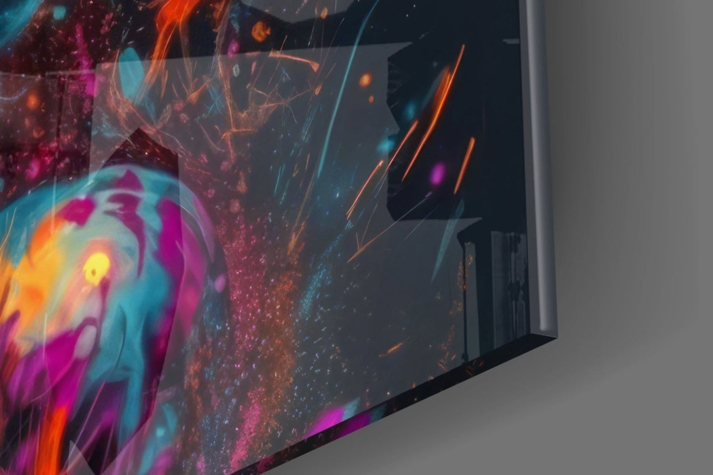 Angled view of colorful glass wall art displaying vibrant magenta, orange, cyan, and yellow abstract patterns with glowing particle effects against dark background.