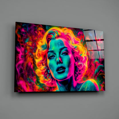 Vibrant neon pop art glass wall panel mounted on gray wall, featuring colorful portrait with magenta, cyan, and yellow tones.