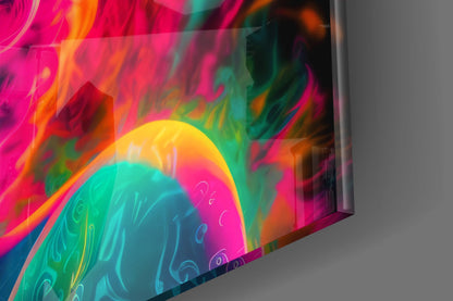 Angled close-up of colorful glass wall art featuring vibrant magenta, orange, yellow, teal, and green swirling patterns with decorative line work detail.