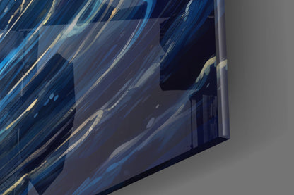 Close-up angled view of blue and white striped glass wall art with dynamic wave-like patterns and metallic accents.