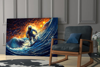 Glass wall art panel displaying an astronaut surfing on a glowing blue wave against an orange and gold fiery sky, displayed in a modern living room setting.