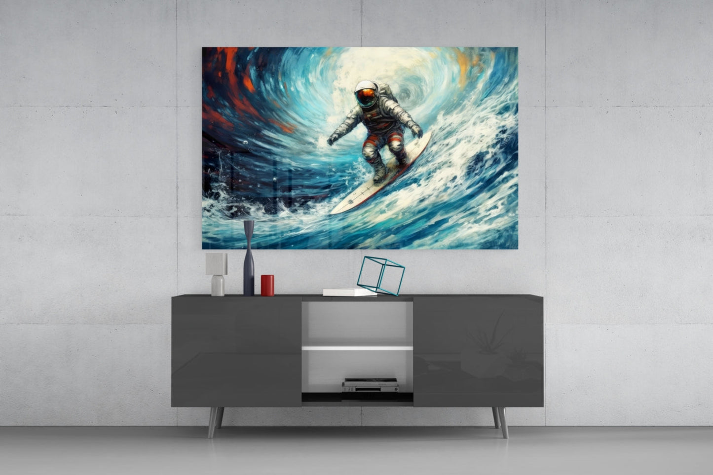 Astronaut surfing a blue wave on glass wall art displayed above a dark media console in a modern living room setting.
