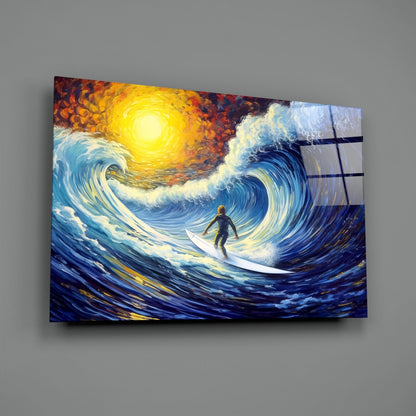 Angled view of glass wall art depicting a surfer riding a swirling blue wave beneath a glowing yellow sun against gray background.