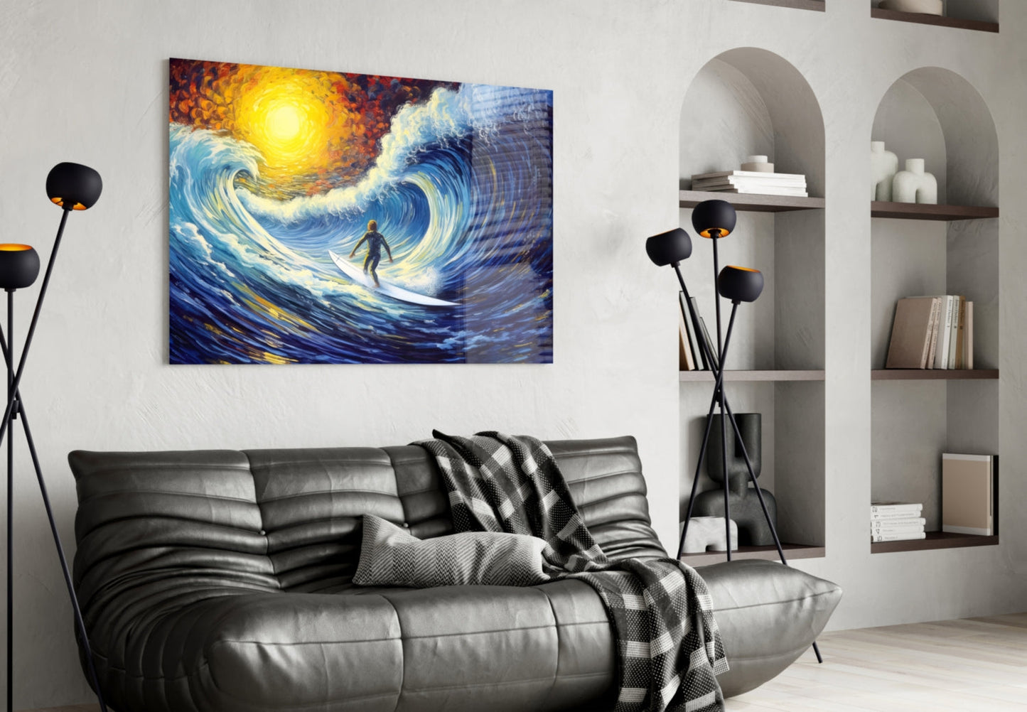 Modern living room with black leather sofa displaying colorful glass wall art depicting a surfer riding a large blue and gold wave.