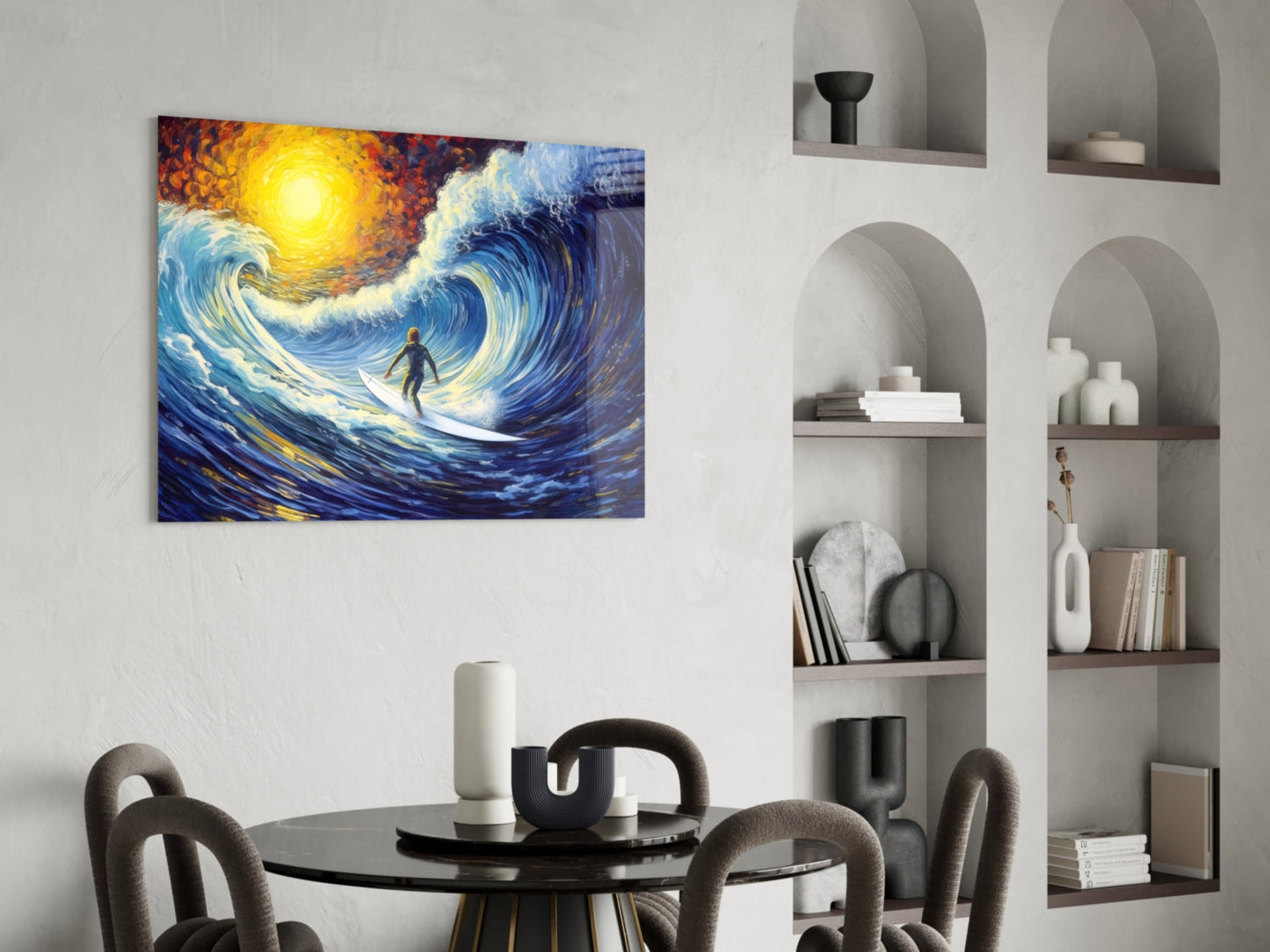 Vibrant glass wall art depicting a surfer riding a swirling blue wave beneath a glowing yellow sun, displayed above a dining table.