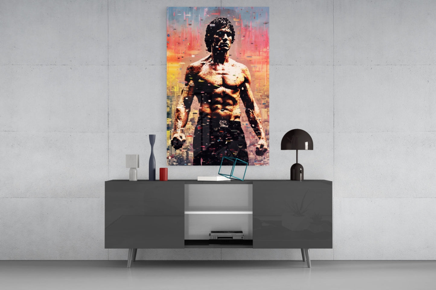 Colorful pop art glass wall panel featuring shirtless muscular man against orange and yellow cityscape backdrop, displayed above modern console table.